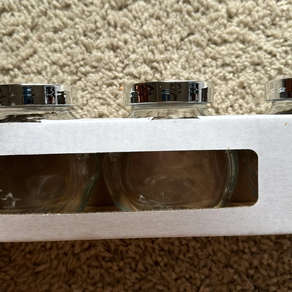 IKEA set of four Rajtan glass spice jars with silver lids